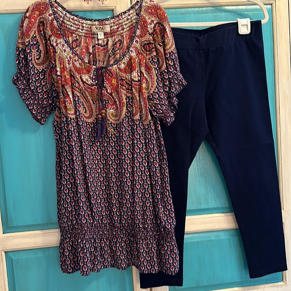 Outfit, stretch capris and boho top and pierced hoop earrings.